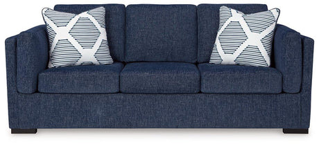 Ashley Furniture Evansley sofa with plush cushions and neutral upholstery, showcased in a modern living room setting.