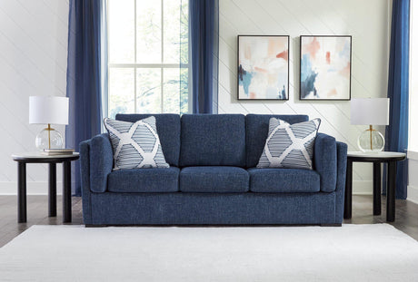 Ashley Furniture Evansley sofa with plush cushions and neutral fabric, showcasing a modern living room setup.