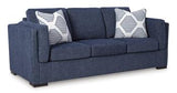 Ashley Furniture Evansley sofa with plush cushions and neutral fabric, showcasing a modern living room style.