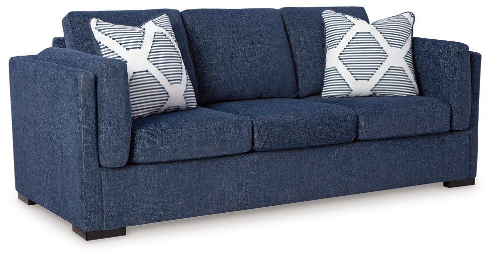Ashley Furniture Evansley sofa with plush cushions and a modern design, shown in a stylish living room setting.