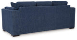 Ashley Furniture Evansley Sofa, plush upholstered sofa with rolled arms and wooden legs, in a neutral fabric.