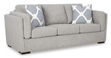 Ashley Furniture Evansley Sofa with plush cushions and neutral fabric, showcasing a modern, comfortable living room piece.