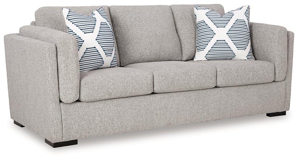 Evansley sofa by Ashley Furniture featuring plush cushions, neutral fabric, and a modern design in a stylish living room setting.