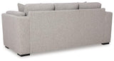 Ashley Furniture Evansley Sofa with plush fabric and wide armrests, shown in a modern living room setting.