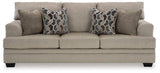 Ashley Furniture Stonemeade sofa showing plush fabric, cushioned armrests, and a modern design in a living room setting.