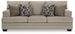 Ashley Furniture Stonemeade sofa showing plush fabric, cushioned armrests, and a modern design in a living room setting.