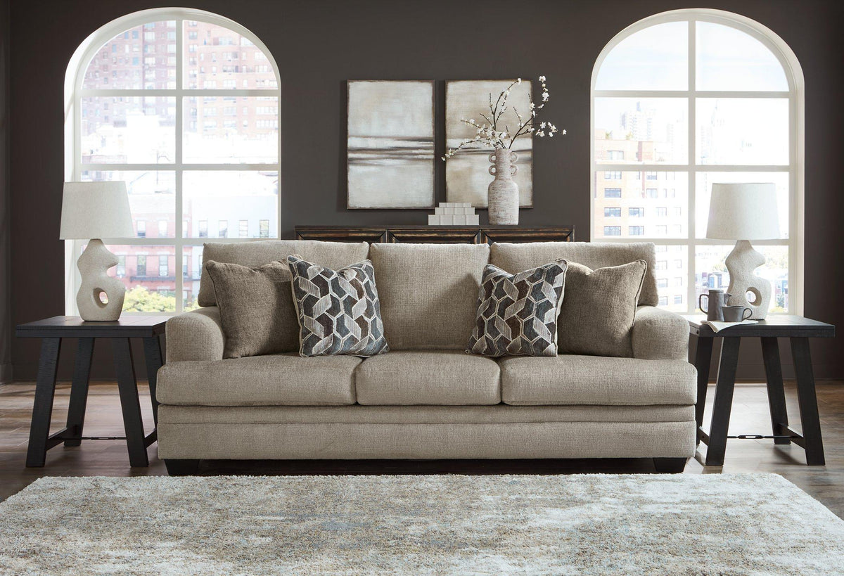 Ashley Furniture Stonemeade Sofa with plush cushions and neutral fabric, showcasing a modern living room setup.