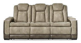 Ashley Furniture Next-Gen DuraPella power reclining sofa with plush cushions and reclining features, shown in a modern living room setting.