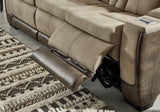 Ashley Furniture Next-Gen DuraPella Power Reclining Sofa with plush cushions and modern design, shown in a stylish living room setting