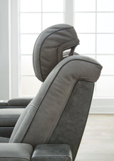 Next-Gen DuraPella Power Reclining Sofa by Ashley Furniture, showing plush gray fabric, padded armrests, and reclining seats.