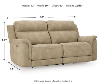Next-Gen DuraPella Power Reclining Sofa by Ashley Furniture, showing plush gray fabric with padded armrests and reclining features.