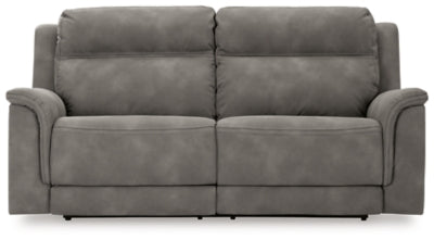 Ashley Furniture Next-Gen DuraPella power reclining sofa with plush cushions and modern design, shown from a front head-on view.