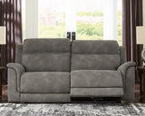 Ashley Furniture Next-Gen DuraPella Power Reclining Sofa with plush cushions and reclining features, shown in a cozy living room setting.