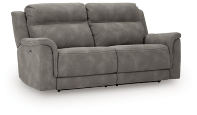 Ashley Furniture Next-Gen DuraPella power reclining sofa with plush cushions and modern design, shown from an angled, closed position.
