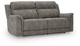 Ashley Furniture Next-Gen DuraPella power reclining sofa with plush cushions and modern design, shown from an angled, closed position.