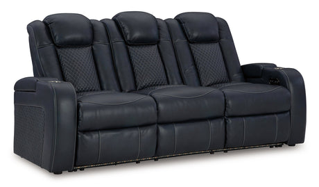 Ashley Furniture Fyne-Dyme Power Reclining Sofa shown from an angled view, featuring plush cushions and a sleek reclining design.