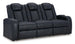 Ashley Furniture Fyne-Dyme Power Reclining Sofa shown from an angled view, featuring plush cushions and a sleek reclining design.