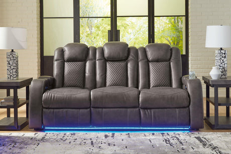 Ashley Furniture Fyne-Dyme Power Reclining Sofa showing plush cushions, reclining mechanism, and modern design in a living room setting.