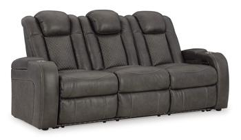 Ashley Furniture Fyne-Dyme Power Reclining Sofa with plush cushions and reclining features, shown in a modern living room setting.