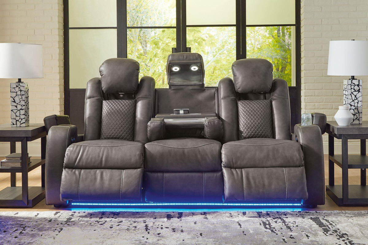 Ashley Furniture Fyne-Dyme Power Reclining Sofa with plush cushions and reclining mechanism, shown in a modern living room setting.