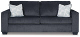 Ashley Furniture Altari sofa with plush cushions and neutral fabric, showcasing a modern living room setting.