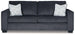 Ashley Furniture Altari sofa with plush cushions and neutral fabric, showcasing a modern living room setting.
