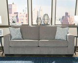 Ashley Furniture Altari sofa featuring plush cushions, neutral fabric upholstery, and a modern design for stylish living rooms.