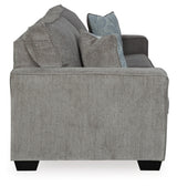 Ashley Furniture Altari sofa with plush cushions and modern design, shown from a side angle in a stylish living room setting.