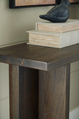 Ashley Furniture Jalenry Console Sofa Table with sleek wooden surface and modern design, ideal for living room decor.