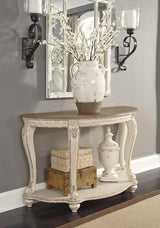 Ashley Furniture Realyn sofa table with wood finish and modern design, featuring a spacious top and sleek legs.