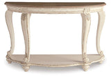Ashley Furniture Realyn sofa table with a sleek wooden design and spacious top, perfect for living room decor.
