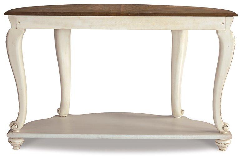 Ashley Furniture Realyn sofa table with a sleek wooden top and open shelving, ideal for modern living room decor.
