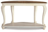 Ashley Furniture Realyn sofa table with a sleek wooden top and open shelving, ideal for modern living room decor.