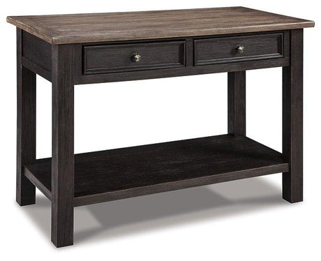 Ashley Furniture Tyler Creek sofa table showing a wooden console with a smooth finish and storage drawers.