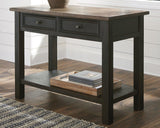 Ashley Furniture Tyler Creek sofa table showing a modern wooden console with clean lines and a warm finish.