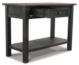 Ashley Furniture Tyler Creek sofa table with wood finish, featuring a sleek console design and spacious surface for living room decor.