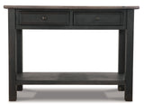 Ashley Furniture Tyler Creek sofa table with a sleek wooden surface and modern design, ideal for living room decor.