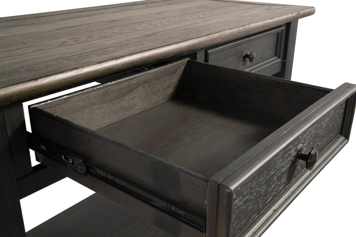 Ashley Furniture Tyler Creek sofa table with a wooden finish, featuring a sleek console design and spacious surface.