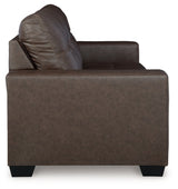Ashley Furniture Barlin Mills sofa with beige fabric and plush cushions, shown from a side angle in a living room setting.