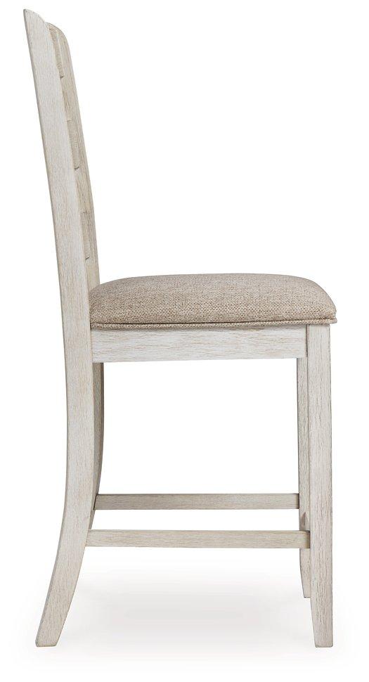 Ashley Furniture Skempton counter height bar stool with wooden legs and upholstered seat, perfect for kitchen or bar area.