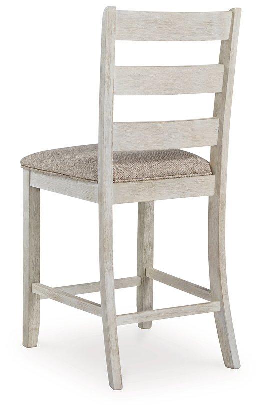 Ashley Furniture Skempton counter height bar stool with wooden legs and a cushioned seat, ideal for kitchen or bar areas.