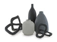 Set of five Ashley Furniture Leithick table accessories, including coasters, placemats, and decorative pieces on a wooden table.