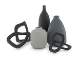 Set of five Ashley Furniture Leithick table accessories, including coasters, placemats, and decorative pieces on a wooden table.