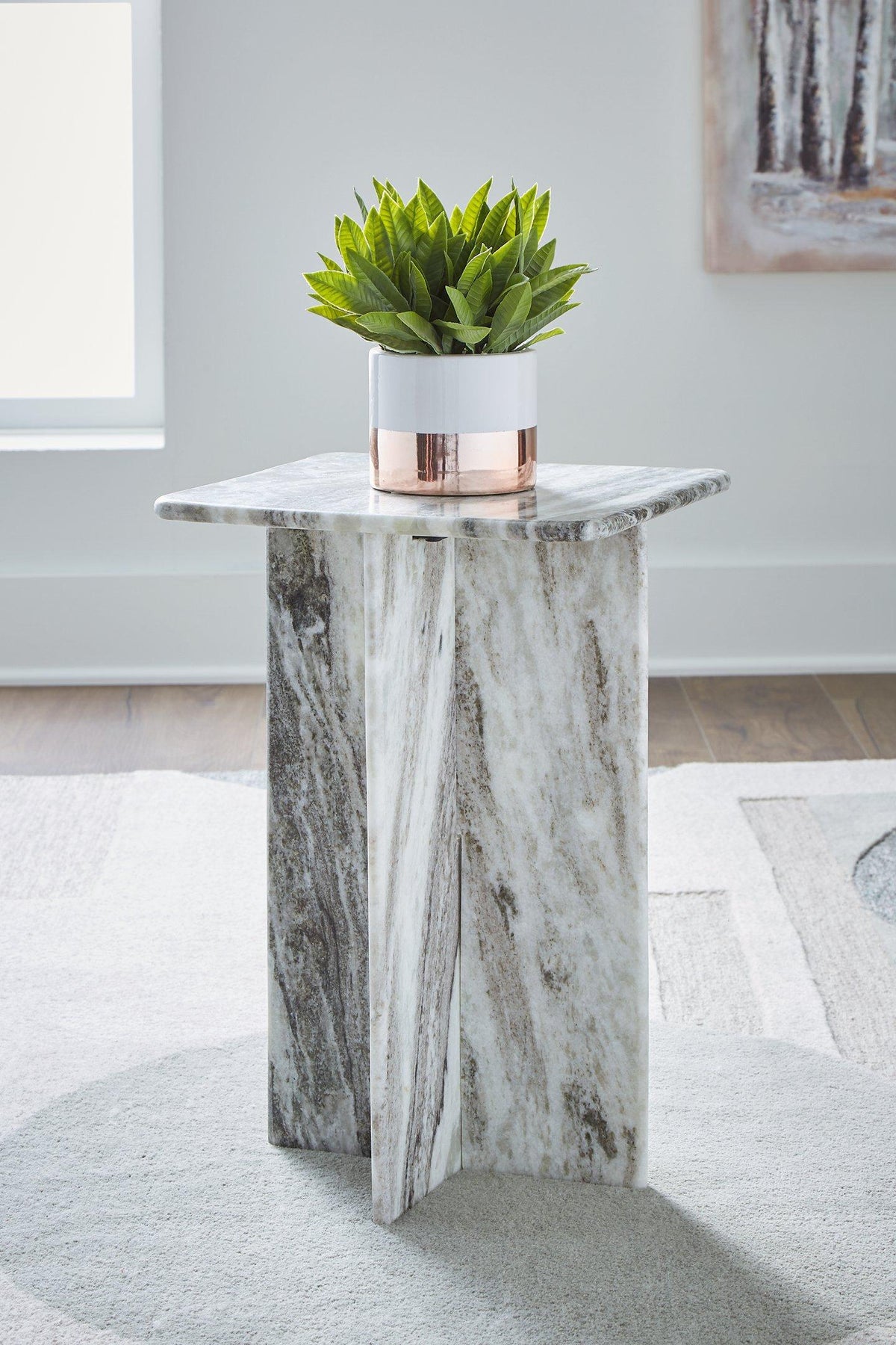 Ashley Furniture Keithwell accent table with a sleek wooden top and sturdy metal legs, perfect for living room decor.