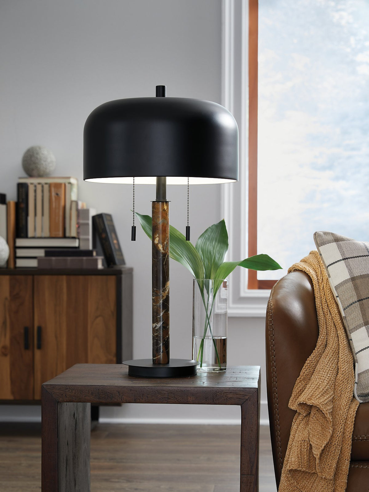 Ashley Furniture Alanbert table lamp with a sleek design, featuring a neutral-colored lampshade and a sturdy base.