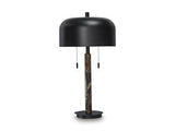 Alanbert table lamp by Ashley Furniture with a sleek design and a neutral-colored lampshade on a wooden table.
