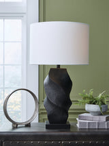 Ashley Furniture Amillion table lamp with a sleek design and fabric shade, shown in a close-up image.