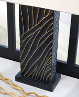 Ashley Furniture Bartlen Table Lamp with a sleek base and fabric shade, ideal for modern home decor lighting.