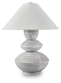 Ashley Furniture Brickdon table lamp with a sleek base and fabric shade, perfect for enhancing home decor.