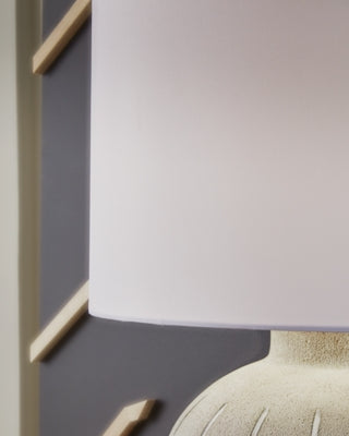 Close-up of the Ashley Furniture Calbert Table Lamp shade with detailed fabric texture and neutral color.